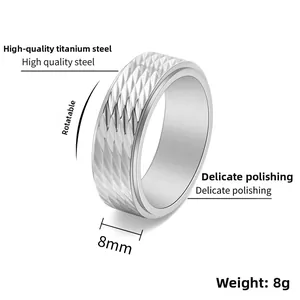 Detail of 8mm rotatable titanium steel ring with textured diamond pattern for men
