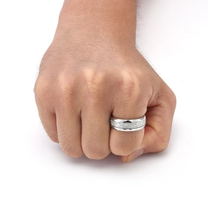 Close-up of men's silver stainless steel ring with a frosted matte center and polished edges