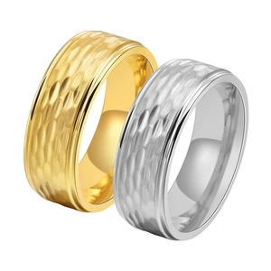 Detailed view of matte hammered honeycomb rings in gold and silver stainless steel
