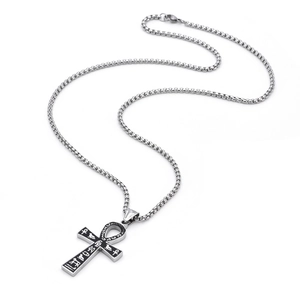 Detailed macro view of Egyptian Ankh pendant with hieroglyphic etchings on a box chain