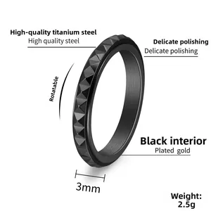 Macro shot of 3mm black titanium spinner ring with pyramid texture and 2.5g weight info