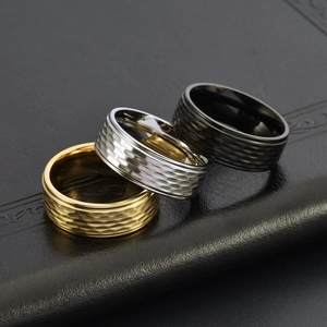Three-piece hammered titanium steel ring set in gold, silver and black finishes