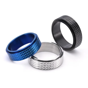 Rotating titanium steel rings in blue, silver and black with diamond cut patterns