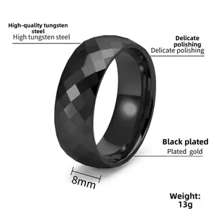 Detailed view of 8mm faceted black tungsten carbide ring with polished geometric diamond cut