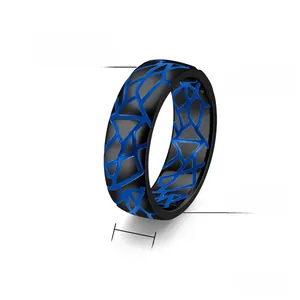 Detail of 7mm men's titanium steel ring with black base and blue geometric grid texture