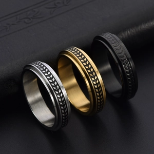 Minimalist spinning olive leaf rings in silver, gold and black stainless steel finish