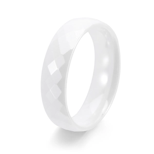 Minimalist white ceramic ring with a faceted geometric surface and smooth inner band