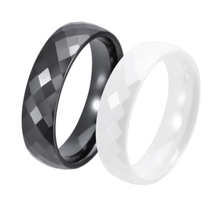 Minimalist black and white faceted ceramic ring set with modern geometric surfaces