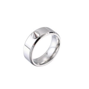 Close-up of polished silver titanium steel ring featuring a single sharp punk style spike