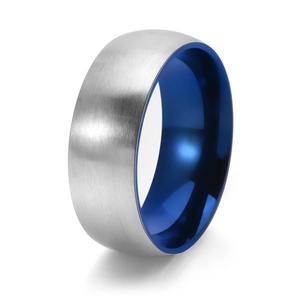 Detailed macro view of brushed silver surface and blue interior of two-tone steel ring