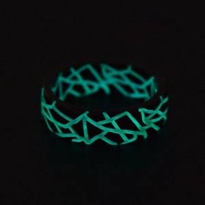 Glow-in-the-dark titanium steel ring with crackle pattern and cyan luminous effect