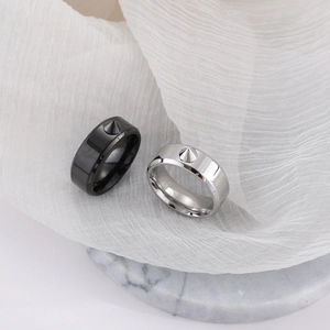 Punk style titanium steel rings in black and silver featuring vertical metal spikes