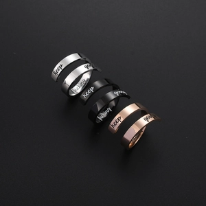 Polished stainless steel spiral rings in silver, black and rose gold with engraving