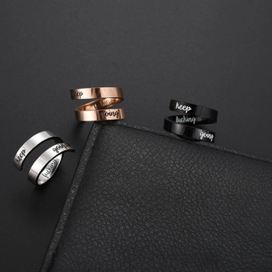 Three-piece stainless steel motivational rings set in silver, rose gold, and black finishes