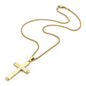 Detailed view of polished gold cross pendant with sleek bead chain on white background