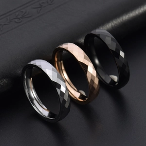 Faceted tungsten steel rings in silver, rose gold and black with diamond cut texture