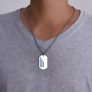 Close-up of men's titanium steel military pendant necklace with blue stripes on a model