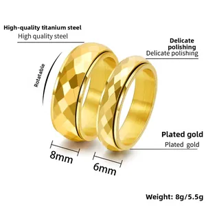Detail view of 6mm and 8mm rotatable gold titanium steel rings with diamond cut patterns