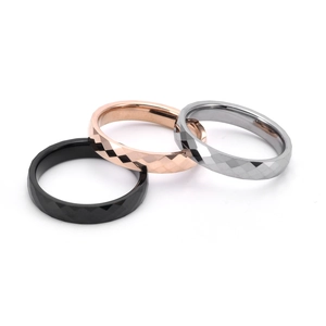 Faceted tungsten steel rings in black, silver, and rose gold with a polished finish