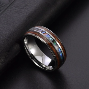 Polished tungsten ring with inlaid wood grain and colorful abalone shell shell textures