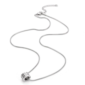 Detailed macro view of the silver cylinder pendant with three grooved layers and snake chain