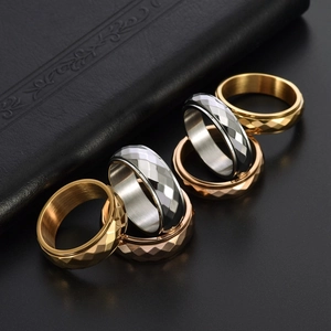 Unisex rotating titanium steel rings with geometric diamond facets in gold silver rose gold
