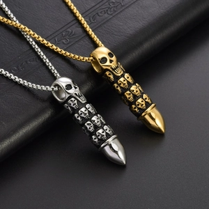 Punk style bullet pendant necklace with skull carvings in gold and silver steel finish