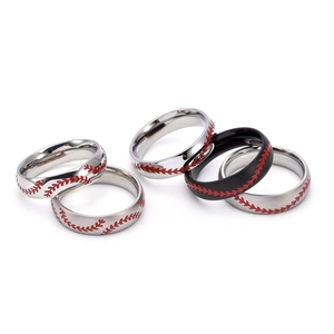 Detail view of five baseball stitch rings in polished silver, brushed silver, and matte black