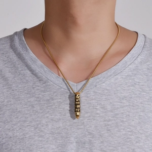 Men's punk gold bullet pendant necklace with skull carvings on a wave bead chain