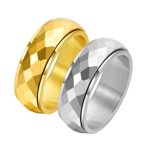 Detailed close-up showing gold and silver titanium steel rings with geometric diamond cuts