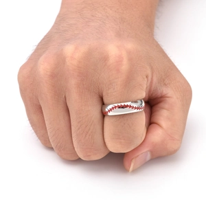 Detail of silver titanium ring featuring unique red baseball stitch pattern on hand