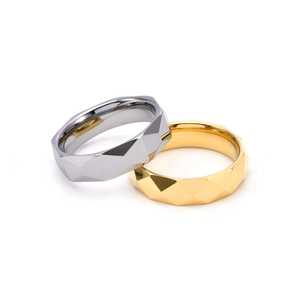 Detailed view of 6mm faceted geometric tungsten steel rings in gold and silver finish