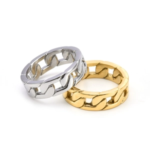 Macro shot of gold and silver Cuban link rings with polished hollow out metal finish