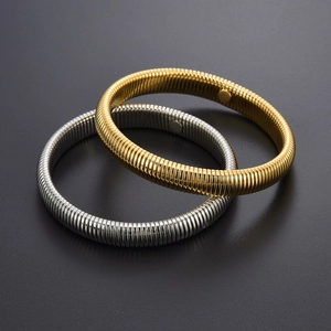 Textured stainless steel spring bracelets with magnetic clasp in gold and silver colors