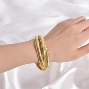Bracciale elastico a tre strati a maglia serpente dorata su seta bianca