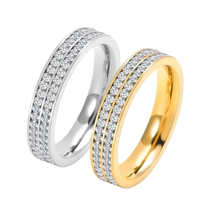 Detail of double-row pavé cubic zirconia rings in silver and 18K gold finishes