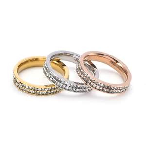 Detailed view of 18K gold-plated double row cubic zirconia rings in three metallic tones