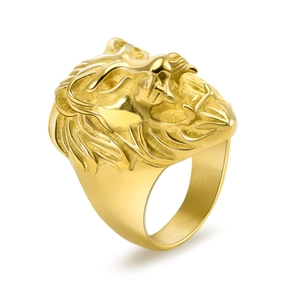 Macro shot of detailed lion head engraving on vintage golden stainless steel ring