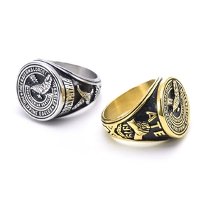 Detail of gold and silver signet rings with eagle brotherhood engraving and 1979 date