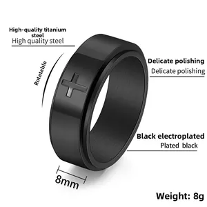 Close-up of 8mm black spinner ring with engraved cross made of high quality steel