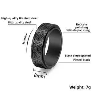 Close-up of 8mm black stainless steel rotating ring with All Seeing Eye engraving