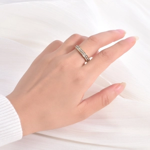 Close-up of a double-row pavé 18K gold-plated titanium ring with sparkling zircons