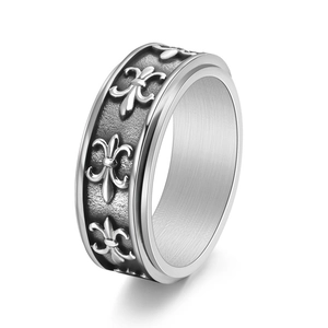 Vintage titanium steel rotating ring with fleur-de-lis patterns in a retro gothic style