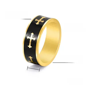 Close-up of 8mm punk stainless steel cross ring with black drip oil finish and gold accents