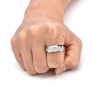 Macro shot of 8mm silver steel ring featuring a matte sandblasted center and polished edges