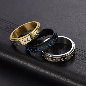Star and moon spinning ring set in gold, black and silver stainless steel