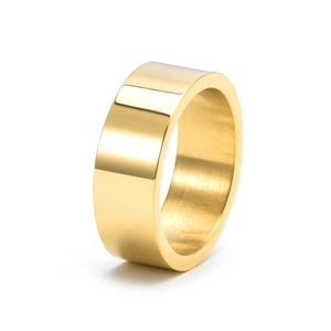 Detailed view of a wide polished gold titanium steel ring with smooth surface finish