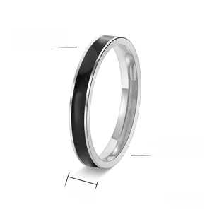 Macro shot of 3mm stainless steel ring with black enamel inlay and polished finish