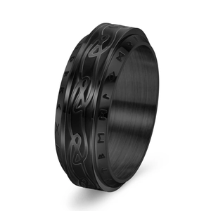 Macro detail of black Viking spinner ring with Celtic knots and Nordic rune engravings