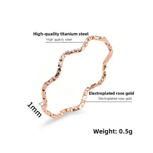 Macro detail of 1mm rose gold wave ring showing 0.5g lightweight steel texture